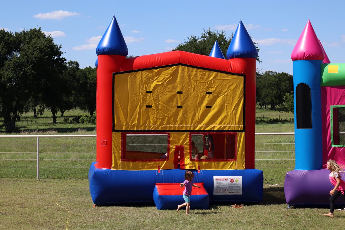 Classic Castle Bounce House rental from Texoma Bounce - red blue and gold castle design
