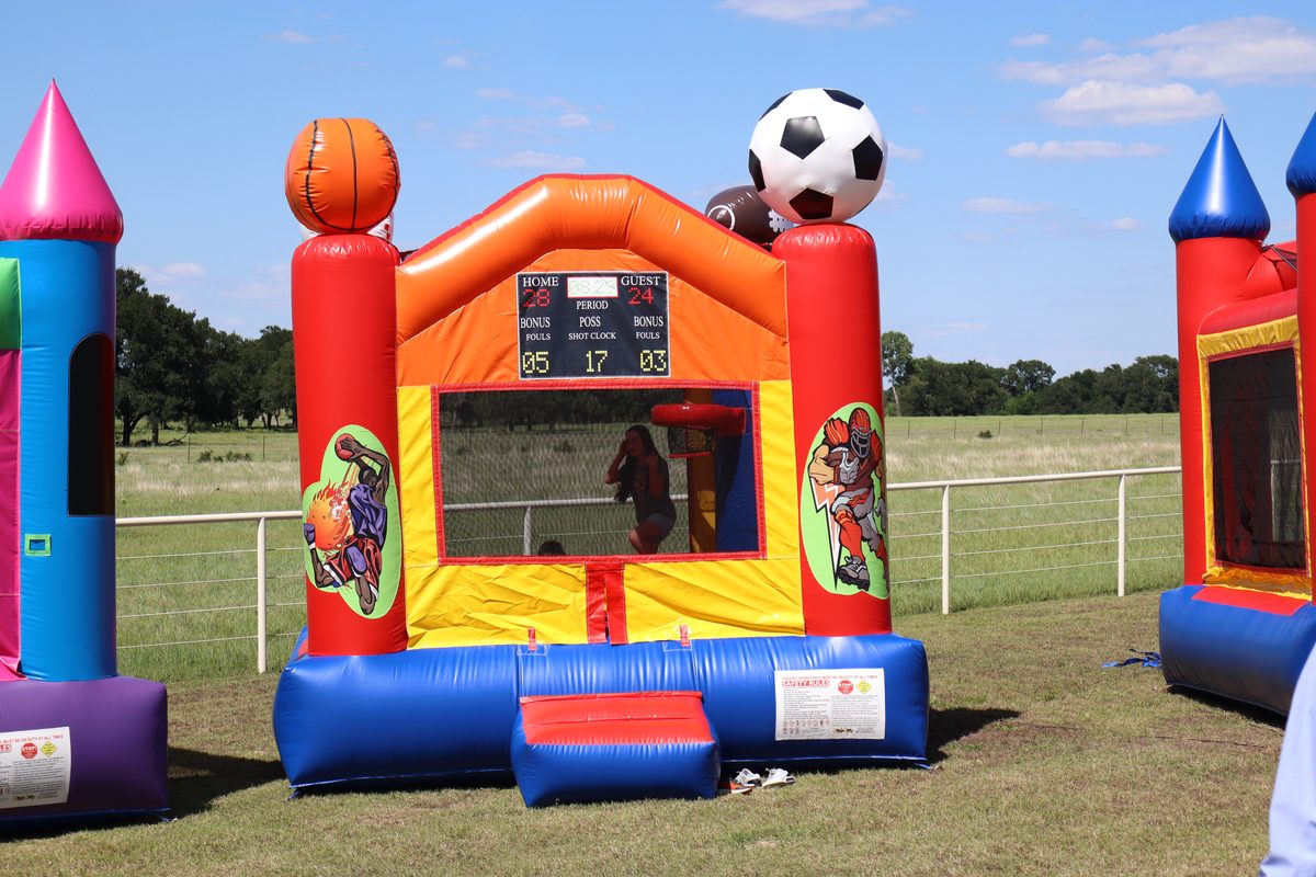Sports Arena Bounce House rental from Texoma Bounce - sports themed inflatable with basketball and soccer decorations